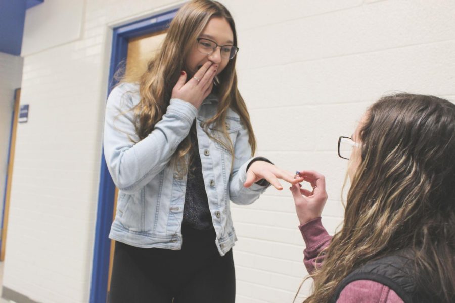 Olivia Crandall gasps in excitement as Maddie Moore fake proposes. 