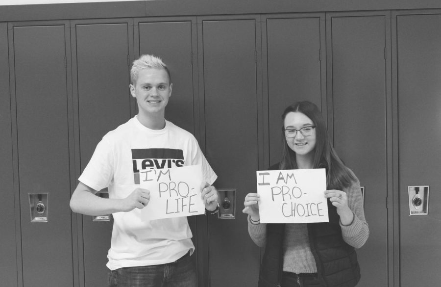 Simon Terpstra and Olivia Crandall shows their stance on abortion.