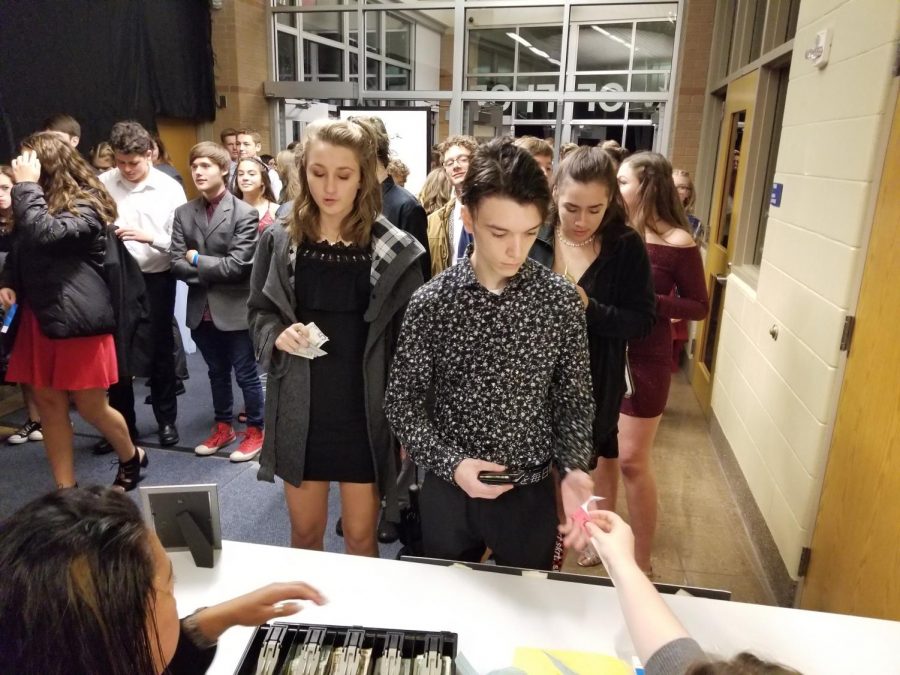 Students Turning in their tickets at last year's homecoming dance
